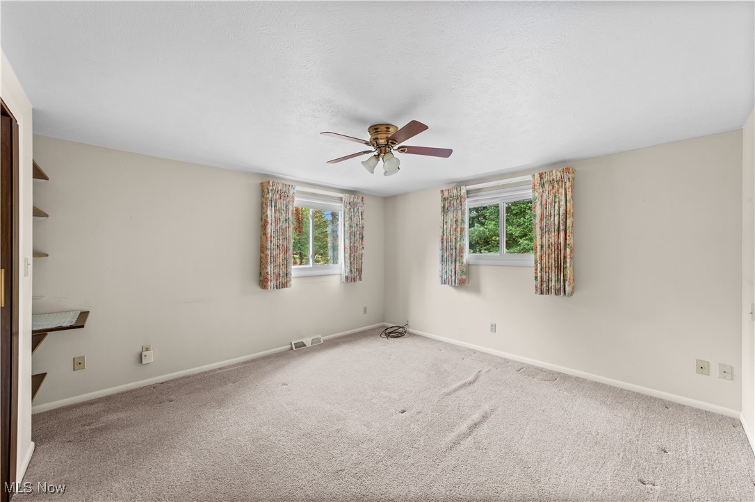 648 Rehwinkle Road Northfield, OH 44067 - Photo 21 of 38 Empty bedroom with carpet and ceiling fan