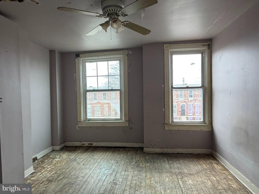 1827 North Milton Avenue Baltimore, MD 21213 - Photo 17 of 49 a view of an empty room with a window