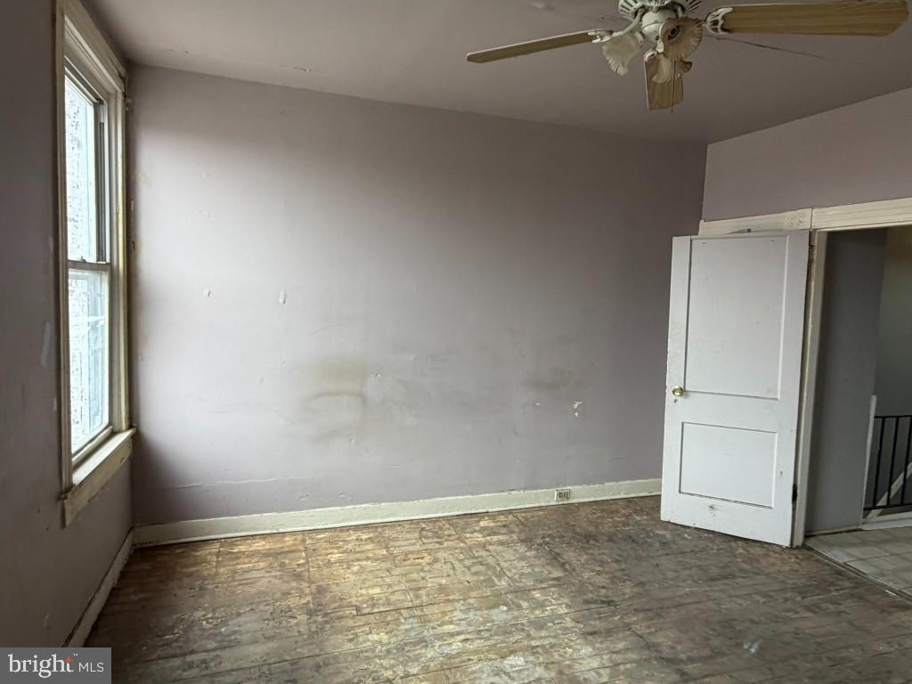 1827 North Milton Avenue Baltimore, MD 21213 - Photo 18 of 49 an empty room with a empty space and chandelier fan