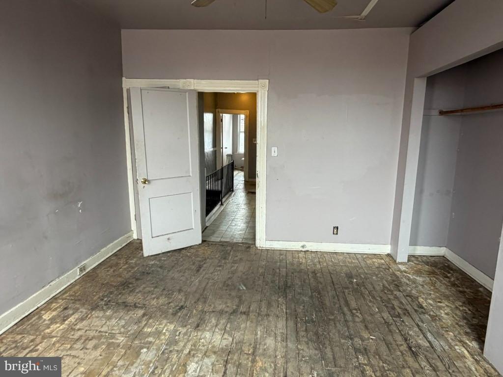 1827 North Milton Avenue Baltimore, MD 21213 - Photo 20 of 49 a view of an empty room with wooden floor and closet