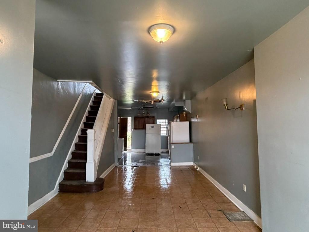 1827 North Milton Avenue Baltimore, MD 21213 - Photo 6 of 49 a view of entryway and hall with wooden floor