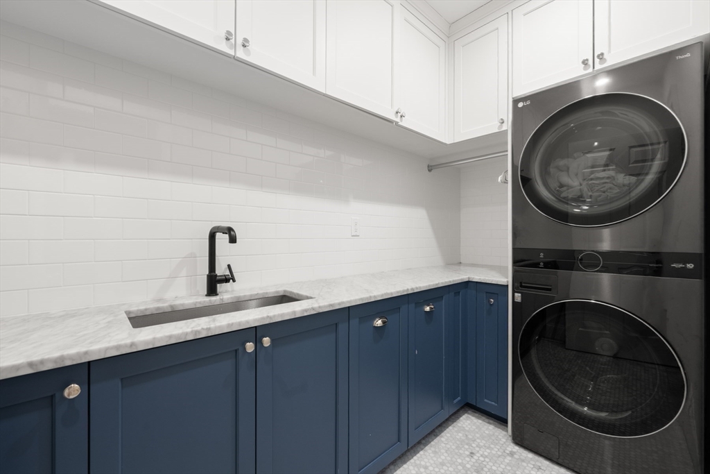 8 Glen Brook Road Wellesley, MA 02481 - Photo 24 of 32 a kitchen with a sink a washer and dryer