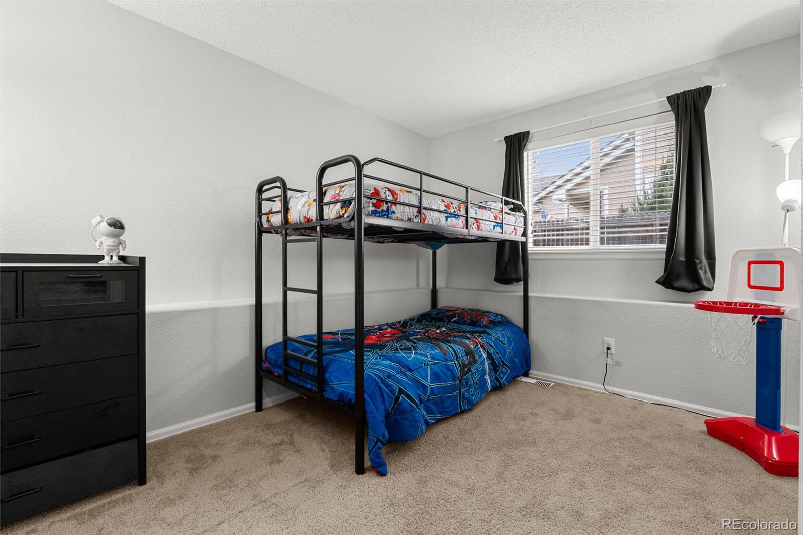 3828 South Rome Way Aurora, CO 80018 - Photo 13 of 19 a bedroom with bed and a window