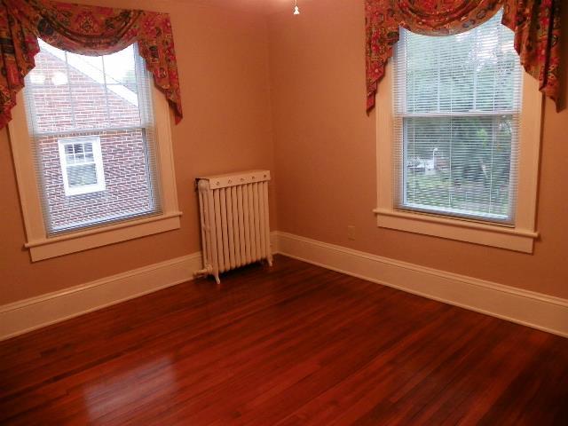 2107 Carter Road Southwest Roanoke, VA 24015 - Photo 12 of 18 a view of an empty room with wooden floor and a window
