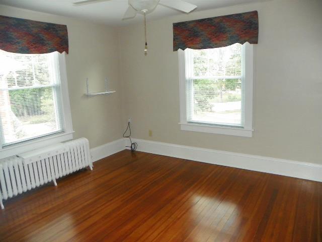 2107 Carter Road Southwest Roanoke, VA 24015 - Photo 14 of 18 a view of an empty room with wooden floor and a window