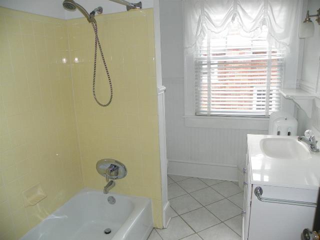 2107 Carter Road Southwest Roanoke, VA 24015 - Photo 17 of 18 a bathroom with a sink a window and shower