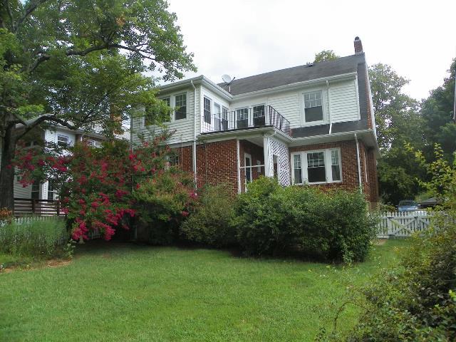 2107 Carter Road Southwest Roanoke, VA 24015 - Photo 3 of 18 a front view of a house with a garden