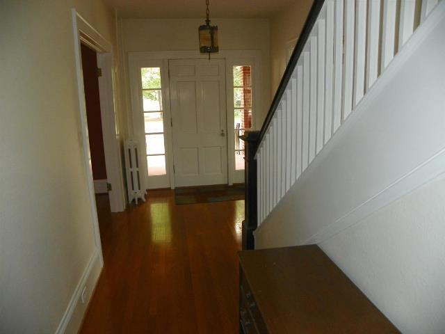 2107 Carter Road Southwest Roanoke, VA 24015 - Photo 10 of 18 a view of a hallway with wooden floor and staircase