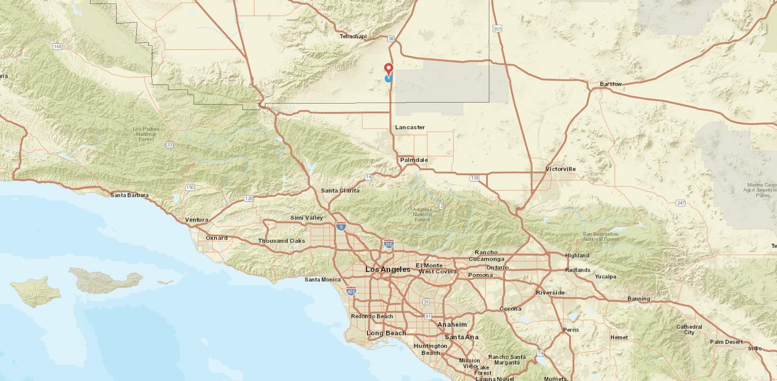 Vic Clark Street Mojave, CA 93501 - Photo 9 of 9 a white bed sitting in a bathroom next to a window