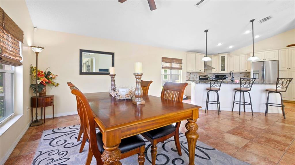 3202 Fox Squirrel Lane Valrico, FL 33596 - Photo 15 of 48 a view of a dining room with furniture