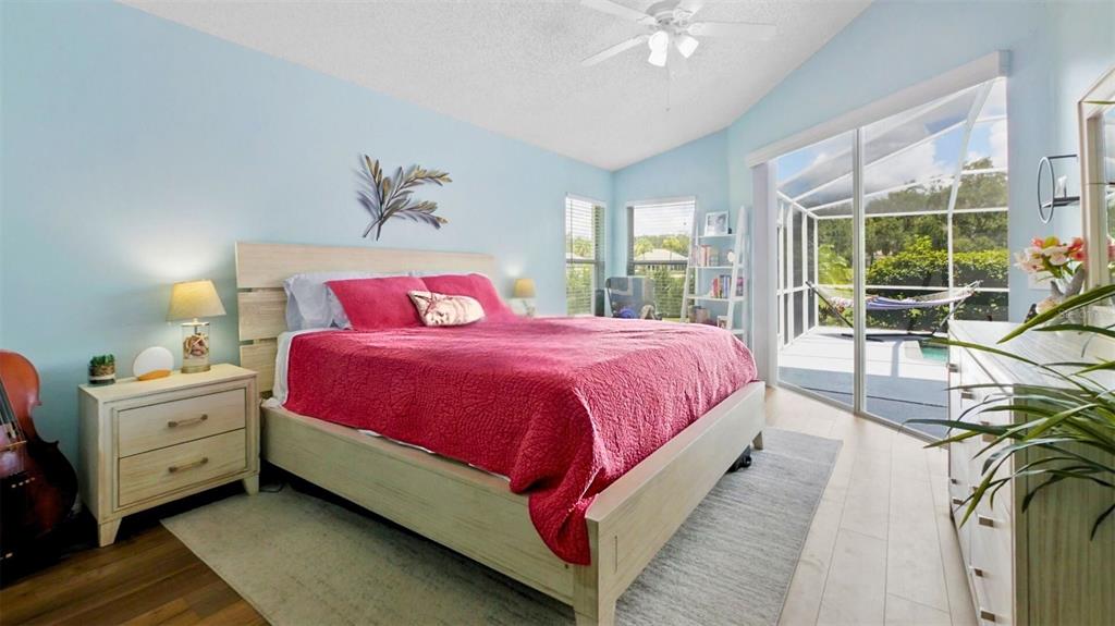 3202 Fox Squirrel Lane Valrico, FL 33596 - Photo 16 of 48 a spacious bedroom with a bed and a large window