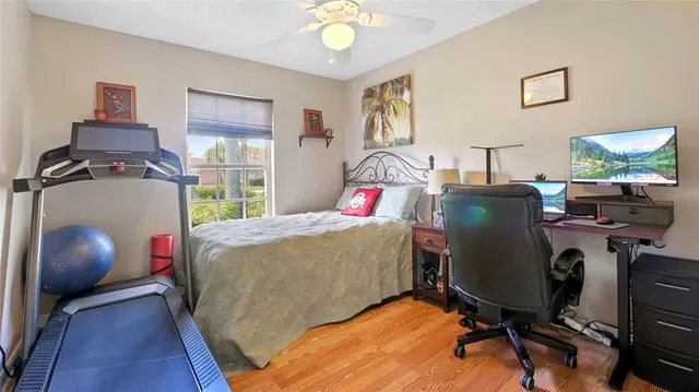 a bed room with a bed and a chair