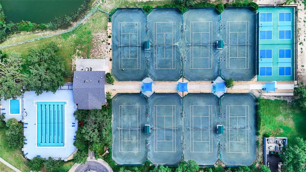 3202 Fox Squirrel Lane Valrico, FL 33596 - Photo 37 of 48 a wooden bench sitting in front of a building