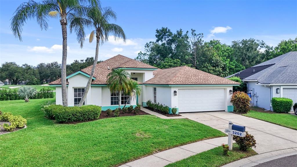 3202 Fox Squirrel Lane Valrico, FL 33596 - Photo 5 of 48 a front view of a house with a garden