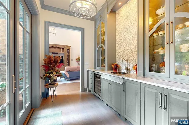 a kitchen with stainless steel appliances granite countertop a sink and a stove next to a window