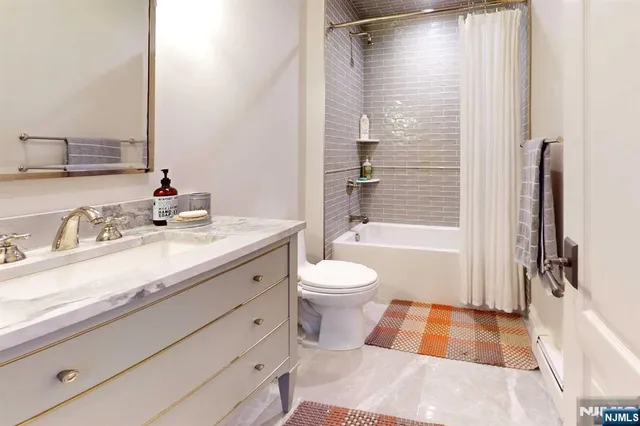 a bed room with a bed and a dresser