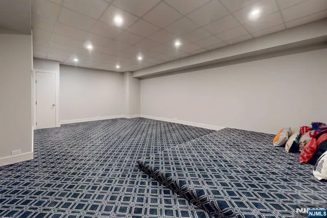 a view of a patio with table and chairs