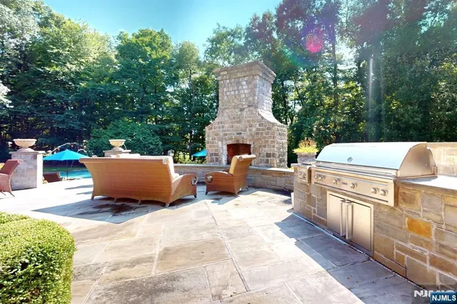 a view of a patio with a table and chairs