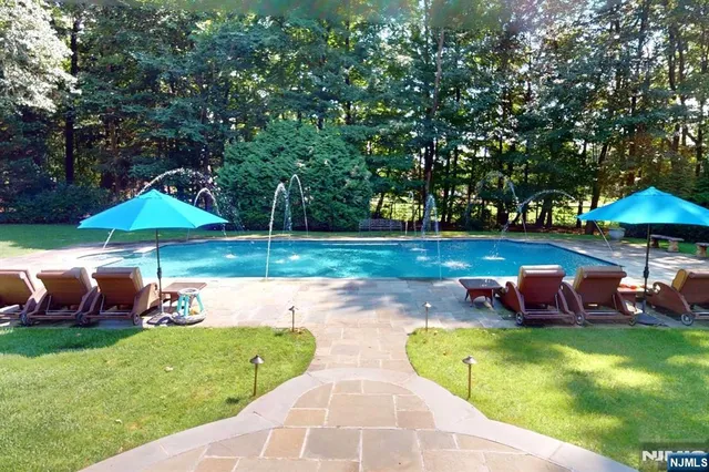a view of a patio with table and chairs