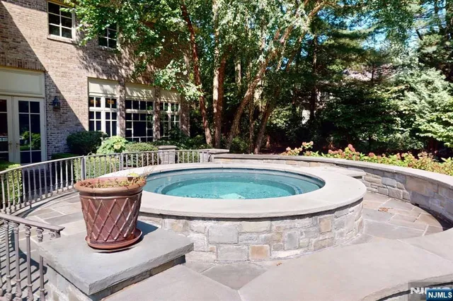 a view of a table and chairs in the garden