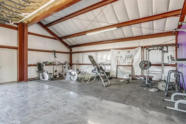 a kitchen with stainless steel appliances granite countertop a refrigerator stove sink and cabinets