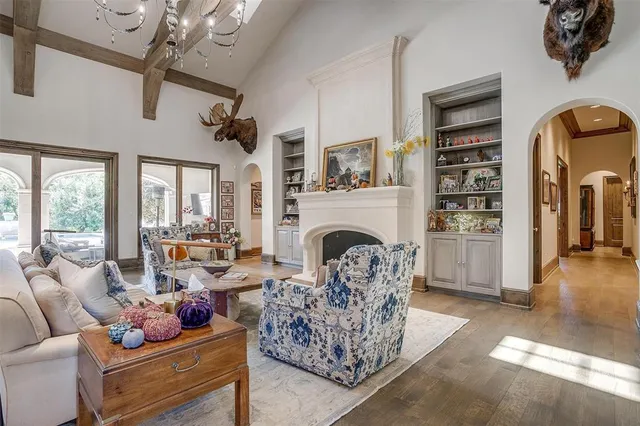 a living room with furniture fireplace and window