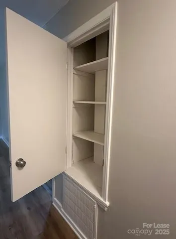 a view of an empty walk in closet