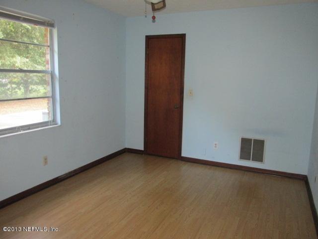 5217 Burdette Road Jacksonville, FL 32211 - Photo 8 of 11 an empty room with windows