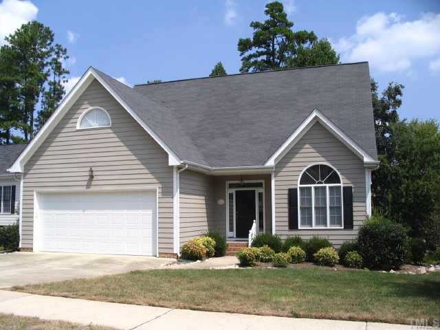 8633 Harps Mill Road Raleigh, NC 27615 - Photo 1 of 10 a front view of a house with garden