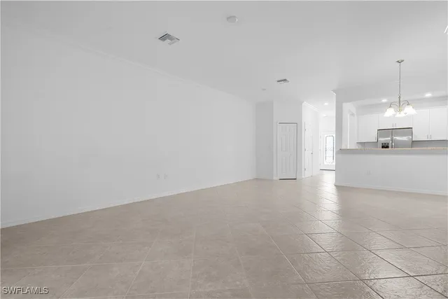 a view of a kitchen with a sink and cabinets