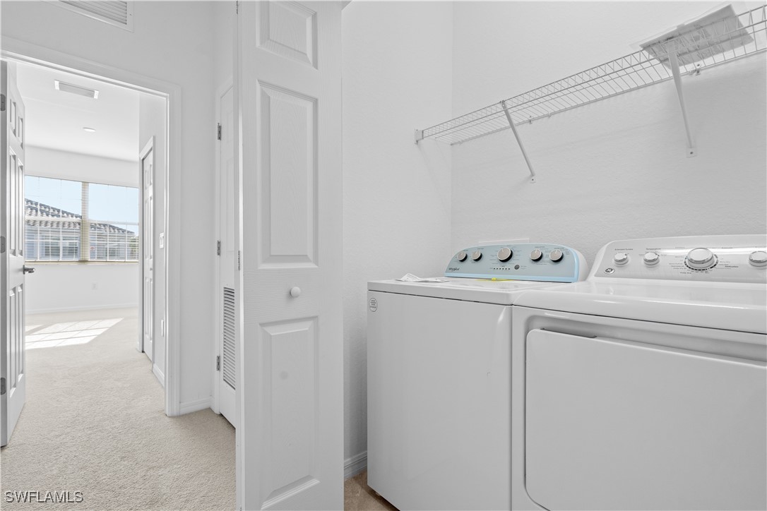 12568 Westhaven Way Fort Myers, FL 33913 - Photo 21 of 26 a utility room with dryer and washer