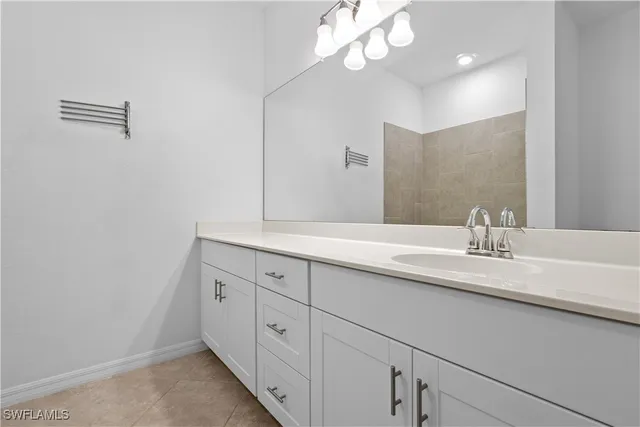 a bathroom with a double vanity sink and a mirror