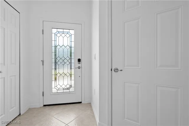a view of an entryway with white walls