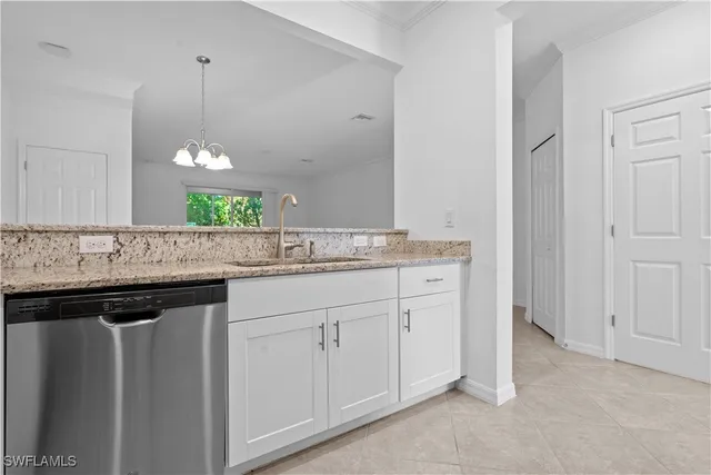 a sink with granite countertop a sink and cabinets