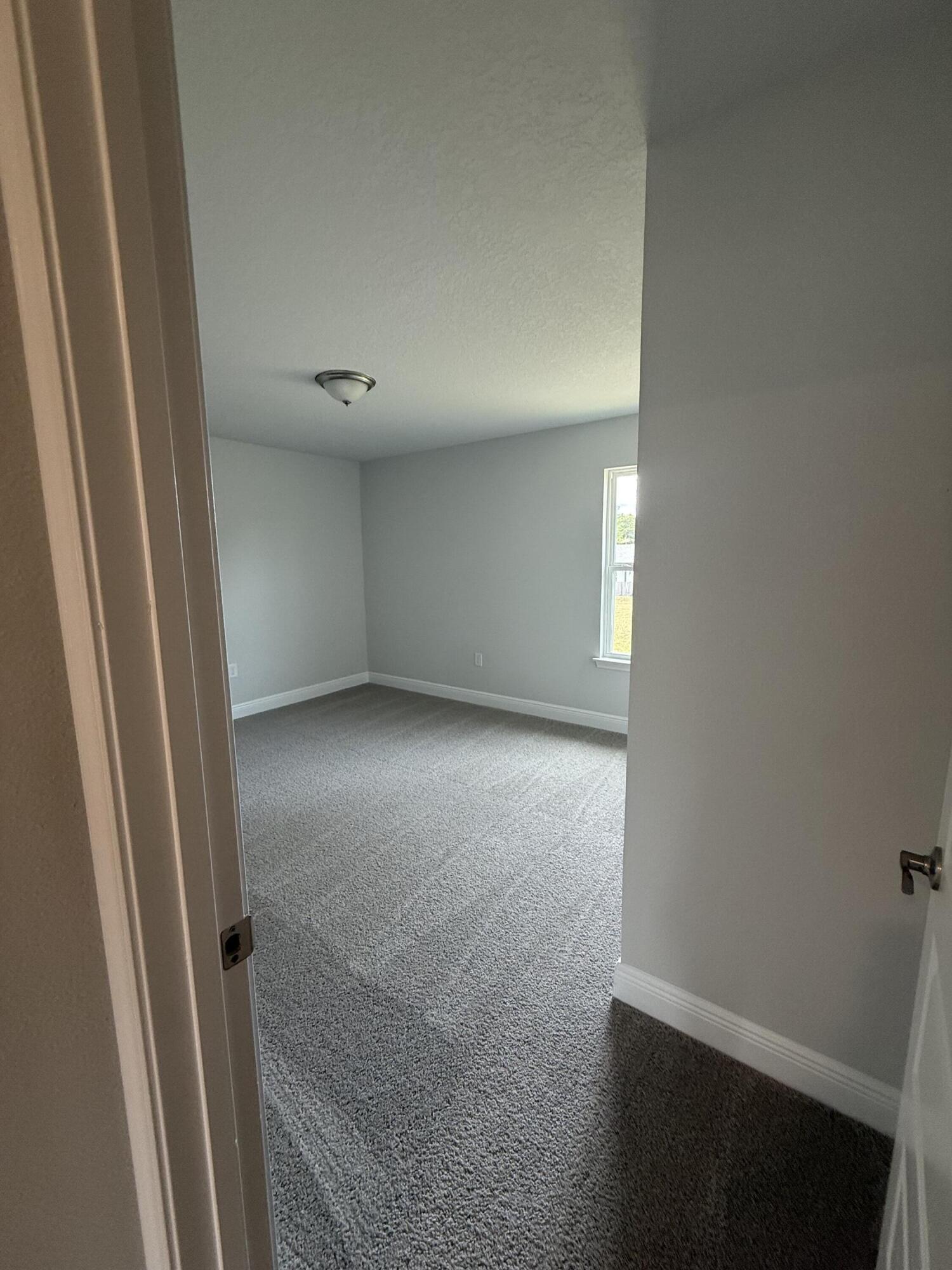 6002 Crocket Cove Crestview, FL 32539 - Photo 12 of 29 an empty room with windows