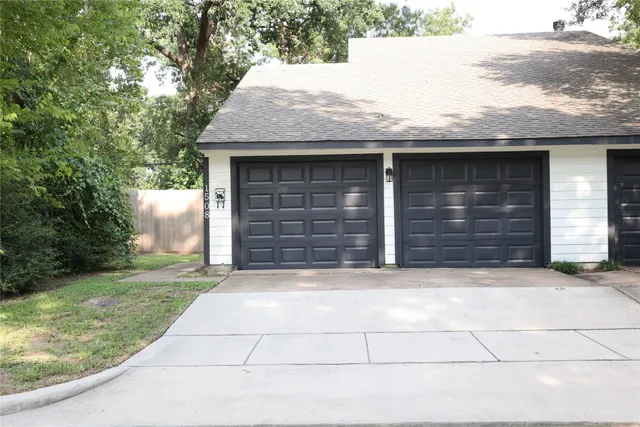 a front view of a house with garage