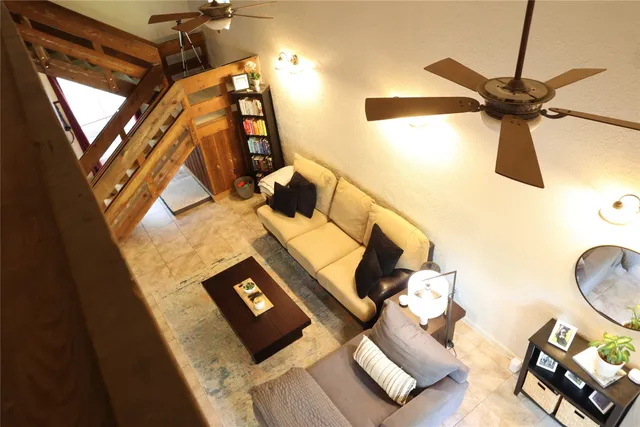 a view of living room with furniture and a window