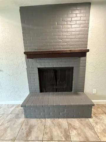 a living room with a fireplace