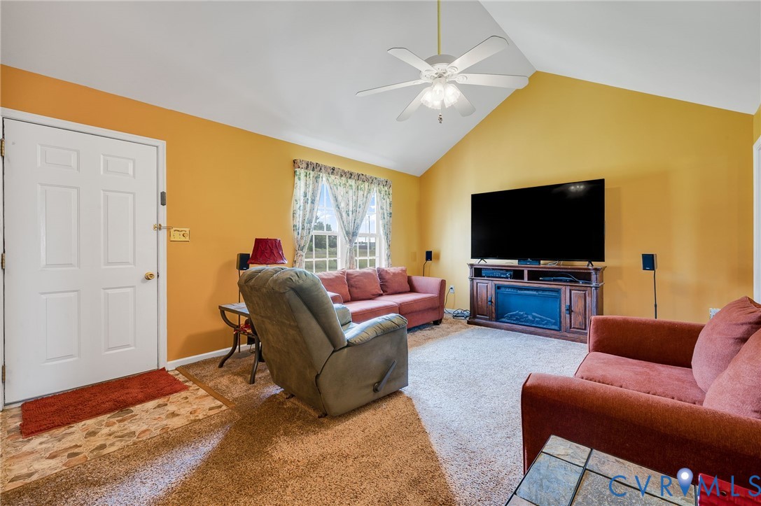 5280 West Quaker Road Disputanta, VA 23875 - Photo 22 of 33 a living room with furniture and a flat screen tv