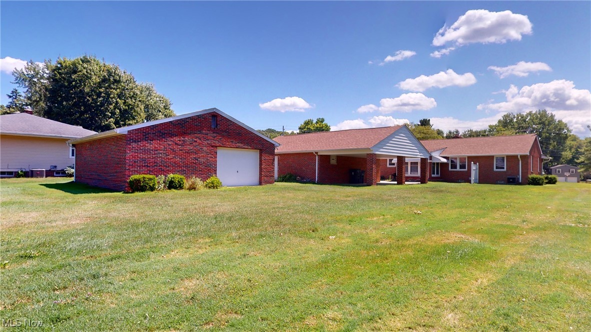 34615 Pettibone Road Solon, OH 44139 - Photo 9 of 40 Rear view of house featuring a yard