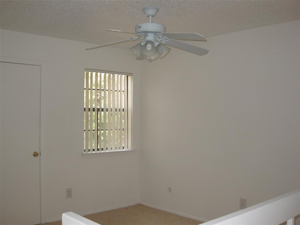 5630 Spring Valley Road, Unit 13C Dallas, TX 75254 - Photo 14 of 16 a view of a room that has a window in it