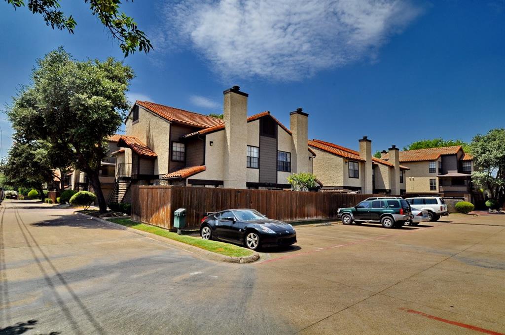 5630 Spring Valley Road, Unit 13C Dallas, TX 75254 - Photo 2 of 16 a view of a street with cars