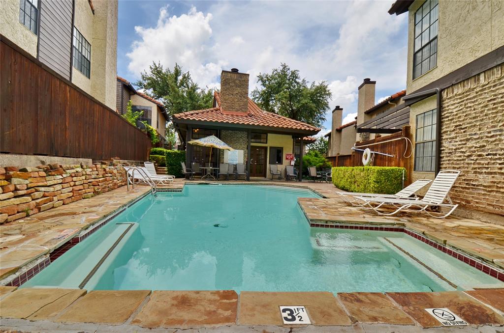 5630 Spring Valley Road, Unit 13C Dallas, TX 75254 - Photo 9 of 16 a view of a swimming pool with a yard