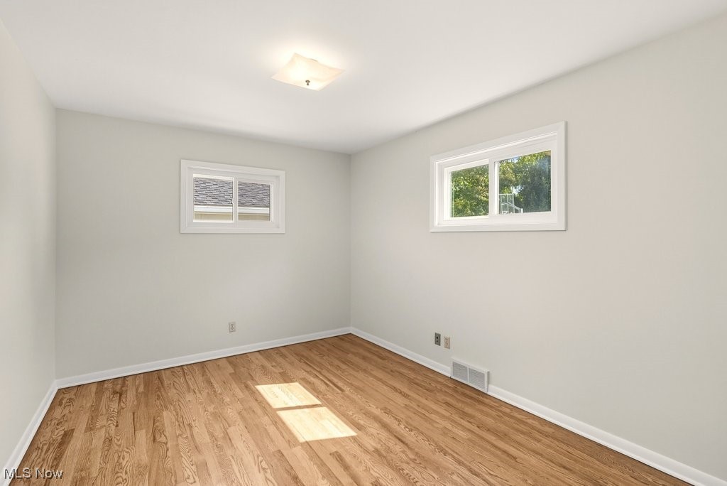 181 Boston Mills Road Hudson, OH 44236 - Photo 27 of 33 Empty room with light wood finished floors and baseboards