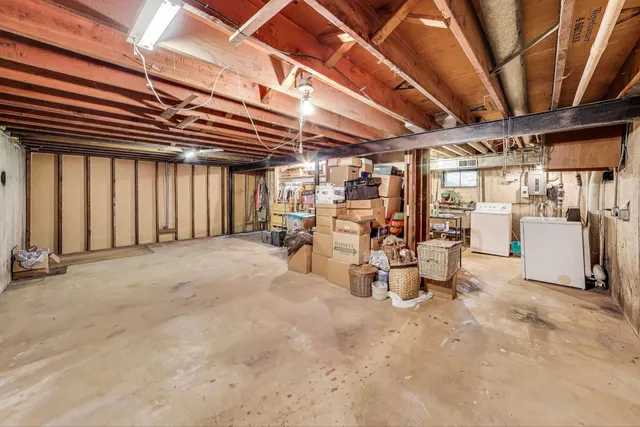 a view of a room with wooden ceiling