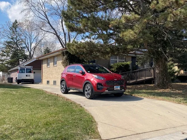 a view of a car in front of a house