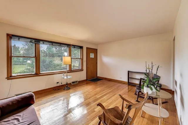 a view of a room with furniture and window