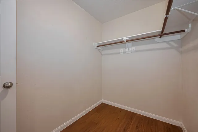 a view of a room with shelf on the wall