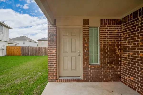 a view of house with backyard