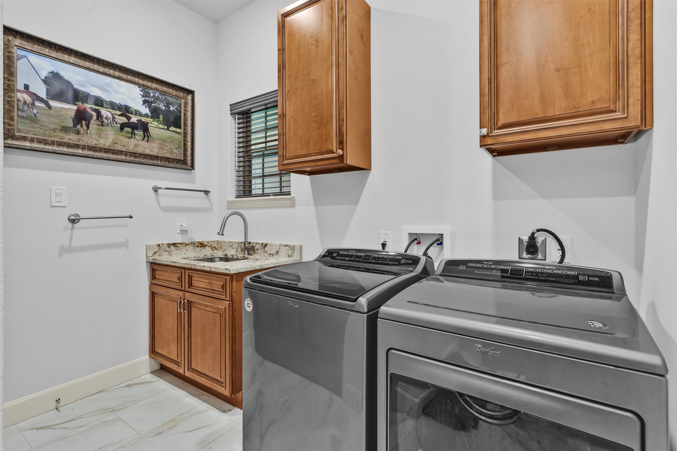 264 Grey Feather Road Huntsville, TX 77340 - Photo 22 of 31 Spacious laundry room with utility sink, granite counters, and abundant storage.